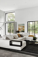 White sofa combination in high-ceilinged open-plan interior