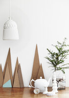 Decorative paper mountains and porcelain teapot