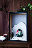 Mini Christmas scene, arranged in a wooden shadow box