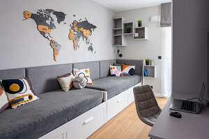 Beds with grey covers and desk in siblings' bedroom