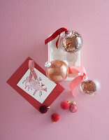 Glittering Christmas baubles and Christmas card