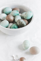 Marbled colored Easter eggs in turquoise, brown, and bronze