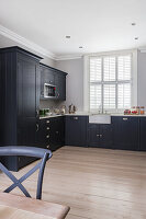 Fitted kitchen with grey cupboards
