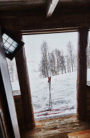 View to snowy mountains from Litlestol a wooden cabin situated in the mountains of Sirdal, Norway