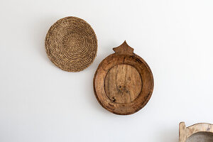 Wall mounted basket and wooden dish in Reigate home, Surrey, UK
