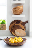 Chopping boards and bowls with lemons in Reigate kitchen, Surrey, UK