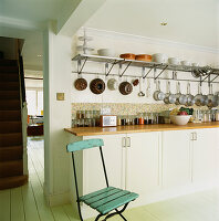 Country style kitchen with open storage solutions