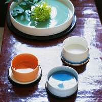 Colourful ceramic home ware on a coffee table