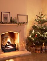 Christmas tree beside lit fire
