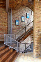 Staircase with brick walls