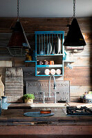Rustic kitchen with ship lap wall and industrial lights
