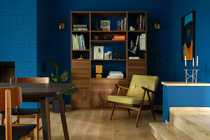 Wooden furniture and blue wall design in retro living room