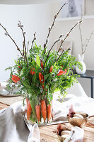 Bouquet of carrots as a table decoration for Easter