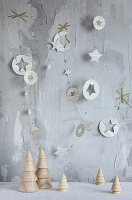 DIY garland made of book pages and wooden Christmas trees