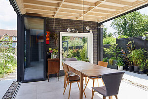 Dining area with folding doors on both sides