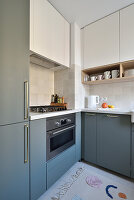 Fitted kitchen in sage green and cream colors