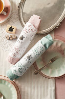 Printed paper cuffs as napkin rings