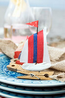 DIY sailboat made from clothes pegs as napkin holder