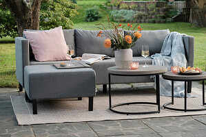 Grey sofa corner and side table set on the patio
