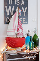 Nautical decor with homemade sailing boat and fairy lights