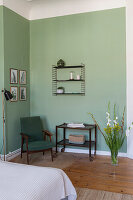 Sitting area in the bedroom with green walls