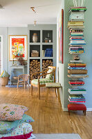 Living room with wall shelf for books, logs and chair with chequered pattern