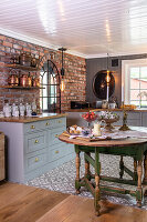 Country-style kitchen with brick and wooden furniture