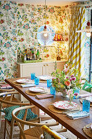 Dining area with floral wallpaper