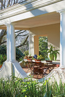 Set table on a covered terrace in the garden