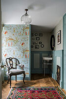 Vintage-style hallway with wallpaper featuring animal motifs and an oriental rug
