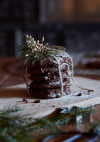 Chocolate cookies decorated for Christmas on a wooden board