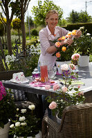 Woman pruning rose