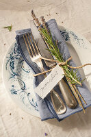 French table setting with rosemary and lavender