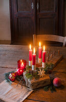 Wooden table decorated for Christmas with DIY Advent wreath