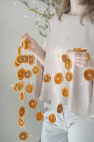 DIY garland made from dried orange slices as a Christmas decoration