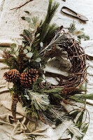 DIY wreath made from natural materials with cones and twigs