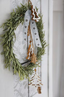 Door wreath decorated for Christmas