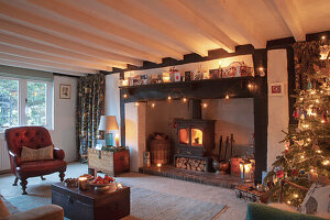 Cosy living room with wood-burning stove and Christmas decorations