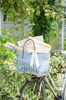 Bicycle with basket in the summer garden