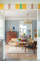 Retro living room with blue walls and vintage furniture