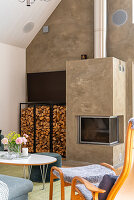 Fireplace with firewood shelf in living room with high ceilings