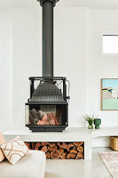 Modern fireplace with wood storage in minimalist living room