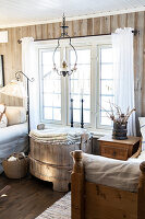 Cosy living room with rustic wooden furniture and white window frames