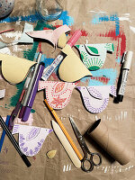 DIY bird garland made from painted cardboard rolls