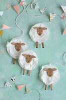 DIY Easter decorations: sheep made from white muffin cases and cardboard