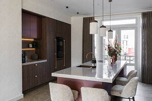 Modern kitchen with dark wood cabinets and kitchen island