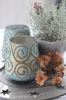 Autumnal decoration with lanterns, dry hydrangea flowers and ornamental plants