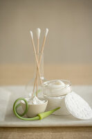 Natural care creams, cotton buds, cotton pads