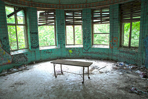 An old operating room with a couch in the abandoned Beelitzer Heilstätten, Beelitz, Germany