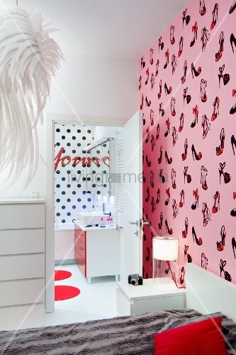 Bed Against Wall With Shoe Patterned Pink Wallpaper View Into Bed Against Wall With Shoe Patterned Pink Wallpaper View Into Ensuite Bathroom Black Polka Dot